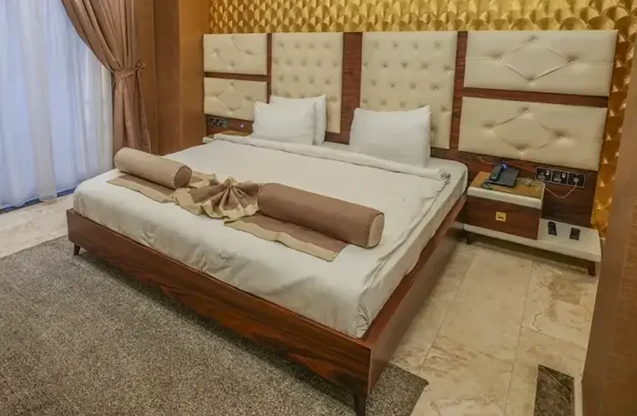 Granada Hotel Najaf custom hotel guestroom furniture, upholstered headboard and wooden bed manufactured by I-Hotel Furniture