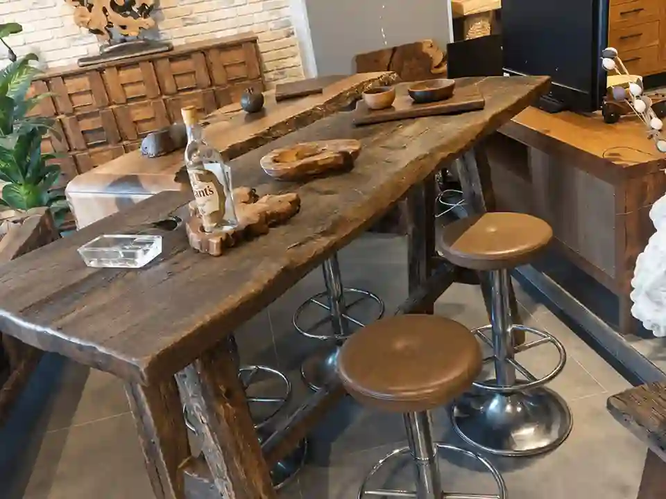 Custom reclaimed wood high bar table for restaurant and hospitality interiors