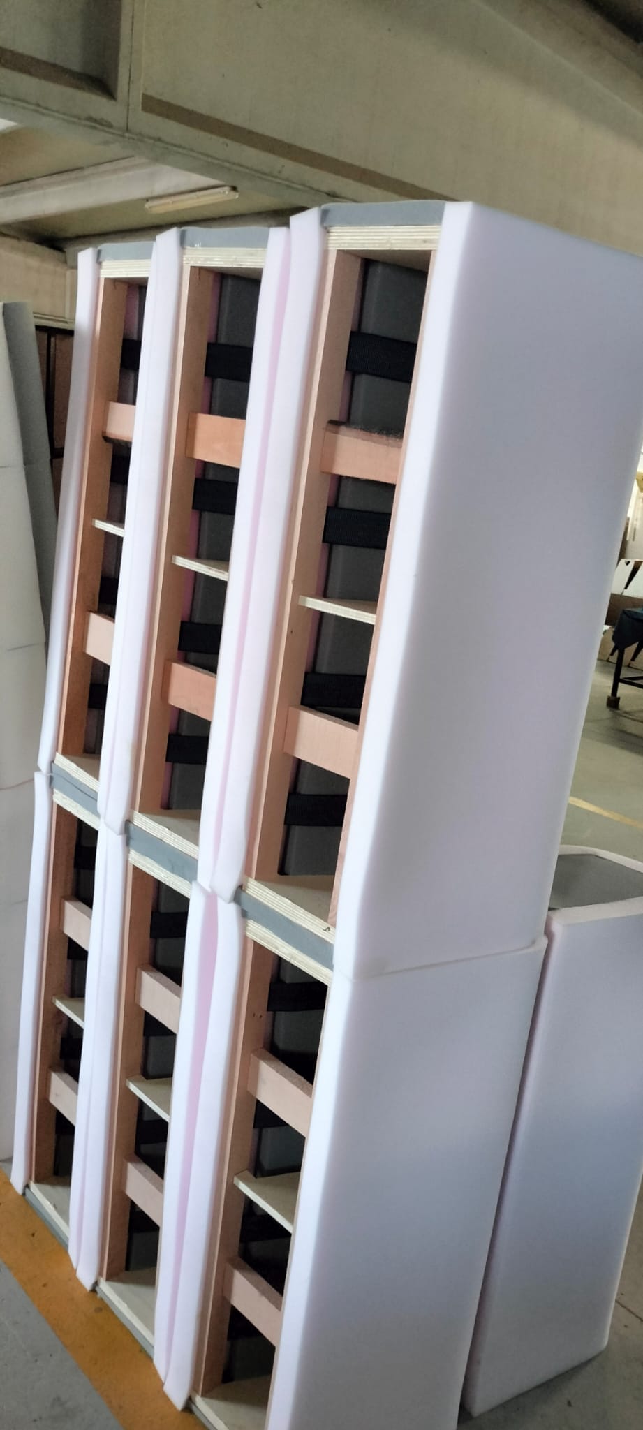 Webbing and upholstery foam preparation during sofa production