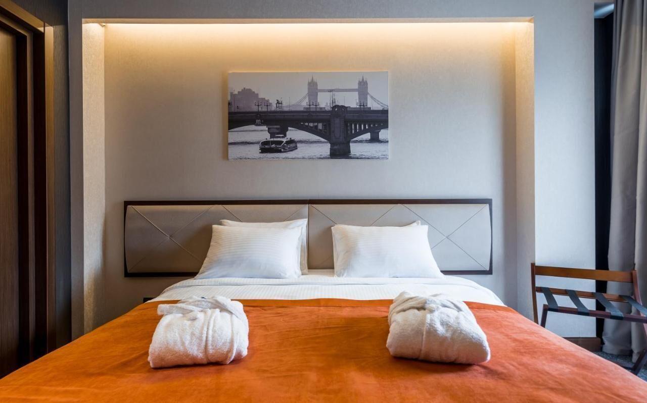 Bridge Hotel Tbilisi Double Room with one large bed and custom installed furniture