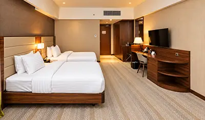 Custom hotel guest room casegoods and public area furniture at The Grand Lux Hotel in Doha, Qatar
