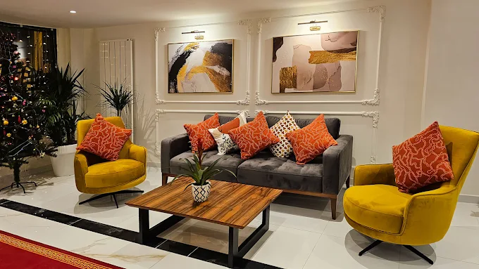 Külsümz Hotel lobby sofas swivel lounge armchairs and solid walnut coffee table
