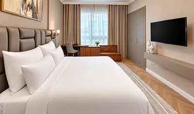 Custom guest room casegoods and upholstered furniture at Royal Regency Holiday Homes in Dubai
