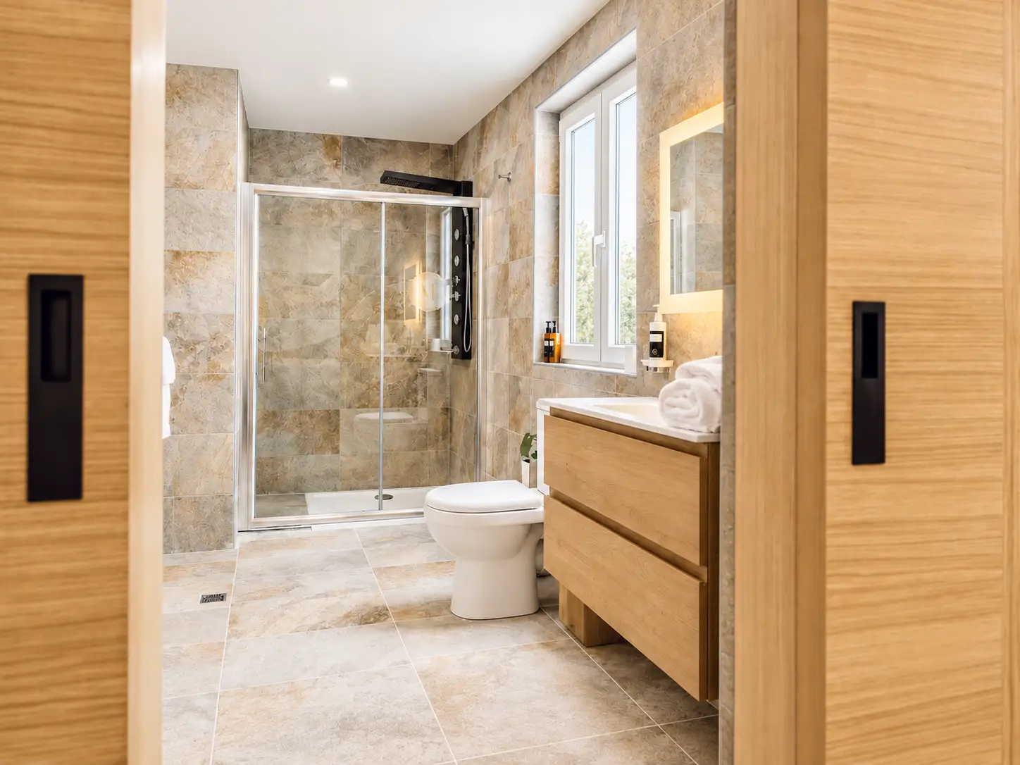 Bathroom fittings and sliding door at The Mike Hotel Malta